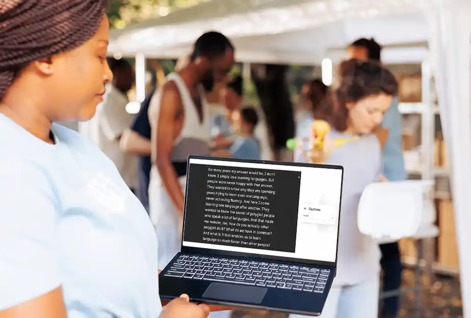 Interprefy - Institutions - Live Captions - Lady infront of laptop